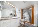 Bright bathroom with granite counters, white cabinets, and decorative shower curtain at 842 Third St, Stone Mountain, GA 30083