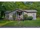 Inviting single-story home with beautiful curb appeal and a well-manicured lawn at 842 Third St, Stone Mountain, GA 30083
