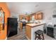 Efficient kitchen with stainless steel appliances and breakfast bar at 842 Third St, Stone Mountain, GA 30083