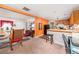 Open-concept living space featuring a kitchen, and living room with large windows at 842 Third St, Stone Mountain, GA 30083