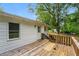 A wooden back deck showcases a great outdoor entertaining space at 10149 Puckett Sw St, Covington, GA 30014