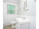 Classic white bathroom, bright and clean with modern fixtures at 10149 Puckett Sw St, Covington, GA 30014