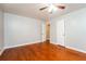 Bedroom boasts hardwood floors, closet, neutral walls and doorway to another room at 10149 Puckett Sw St, Covington, GA 30014