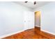 Bedroom features hardwood floors, spacious closet and neutral color palette at 10149 Puckett Sw St, Covington, GA 30014