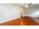 Bright living room with hardwood floors, neutral walls and doorway to another room at 10149 Puckett Sw St, Covington, GA 30014