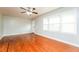 Bright living room with hardwood floors, ceiling fan and lots of natural light at 10149 Puckett Sw St, Covington, GA 30014