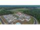 New townhome community featuring a pool, cabana, and green spaces surrounded by wooded areas at 124 Saginaw Ct, Locust Grove, GA 30248