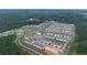 New residential community offering townhomes, green spaces, a pool and cabana area, and convenient parking at 124 Saginaw Ct, Locust Grove, GA 30248