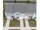 Birds-eye view of townhomes with private driveways and well-maintained landscaping in a neighborhood setting at 124 Saginaw Ct, Locust Grove, GA 30248