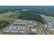 New townhome community featuring a community pool, green spaces, and proximity to wooded areas at 124 Saginaw Ct, Locust Grove, GA 30248