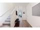 Bright entryway featuring hardwood floors, staircase, and neutral color scheme at 124 Saginaw Ct, Locust Grove, GA 30248
