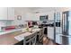 Modern kitchen featuring stainless steel appliances, granite countertops, and ample cabinet space at 124 Saginaw Ct, Locust Grove, GA 30248