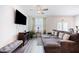 Comfortable living room with a large sectional sofa, modern TV, and stylish decor at 124 Saginaw Ct, Locust Grove, GA 30248