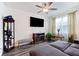 Comfortable living room with a modern television, display case, and natural light at 124 Saginaw Ct, Locust Grove, GA 30248
