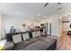 Open concept living space featuring a spacious living room, dining area, and kitchen with stainless appliances at 124 Saginaw Ct, Locust Grove, GA 30248