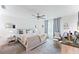 Relaxing main bedroom with a ceiling fan, neutral decor, carpeted floors, and natural light from the window at 124 Saginaw Ct, Locust Grove, GA 30248