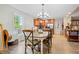 Open dining room with hardwood floors next to the kitchen and a view of the backyard at 561 Holland Rd, Dallas, GA 30157