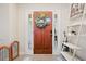 Inviting front entryway featuring a solid wood door with glass panels and a decorative wreath at 561 Holland Rd, Dallas, GA 30157