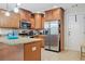 Well-equipped kitchen with stainless steel appliances, granite countertops, and ample cabinet space at 561 Holland Rd, Dallas, GA 30157