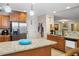 Open kitchen with granite counters, stainless appliances, and wood cabinets with lots of light at 561 Holland Rd, Dallas, GA 30157