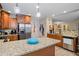 Bright kitchen featuring an island with granite countertop, modern appliances, and abundant storage at 561 Holland Rd, Dallas, GA 30157