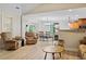 Open concept living room with hardwood floors, neutral paint, and dining room view at 561 Holland Rd, Dallas, GA 30157