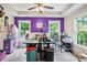 Open office featuring grey wood floors, lots of natural light, and purple accent wall at 561 Holland Rd, Dallas, GA 30157