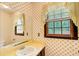 Bathroom with sunny wallpaper and a vanity at 2612 Spring St, Dacula, GA 30019