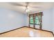 Bedroom with light blue walls, two windows, and baseboard trim at 2612 Spring St, Dacula, GA 30019