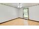 Bedroom features a window with curtains, and baseboard trim at 2612 Spring St, Dacula, GA 30019