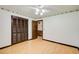 Bedroom with ceiling fan and a closet with louvered doors at 2612 Spring St, Dacula, GA 30019