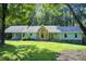 Charming single-story home with stone accents and lush green lawn at 2612 Spring St, Dacula, GA 30019