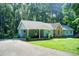 Inviting exterior of a well-maintained home with a covered front porch, perfect for relaxing outdoors at 2612 Spring St, Dacula, GA 30019