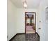 Inviting foyer with unique tiled flooring and a view into the living room at 2612 Spring St, Dacula, GA 30019