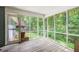 Relaxing screened-in porch with views of the private, wooded backyard at 2612 Spring St, Dacula, GA 30019