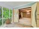Screened porch leading into a living room with a cozy stone fireplace at 2612 Spring St, Dacula, GA 30019