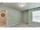 Bright bedroom with a window, green paint, and carpet flooring at 3393 Sardis Bend Dr, Buford, GA 30519
