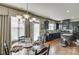 Elegant dining area with a chandelier and views of the kitchen and backyard at 3393 Sardis Bend Dr, Buford, GA 30519