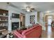 Bright living room with hardwood floors, fireplace, and staircase access at 3393 Sardis Bend Dr, Buford, GA 30519