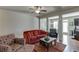 Spacious living room offering hardwood floors, ample seating, and easy kitchen access at 3393 Sardis Bend Dr, Buford, GA 30519