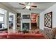 Comfortable living room with a fireplace, hardwood floors, and stylish furnishings at 3393 Sardis Bend Dr, Buford, GA 30519