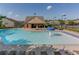 A community pool offers a mushroom fountain and lounging areas for relaxation on a bright, sunny day at 3393 Sardis Bend Dr, Buford, GA 30519