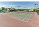 Community tennis courts with lighting for evening play, surrounded by green landscaping and nearby pool at 3393 Sardis Bend Dr, Buford, GA 30519