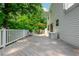 A relaxing back deck with a dining set with views of the trees at 350 Birch Rill Dr, Alpharetta, GA 30022