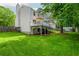 Lush backyard with a spacious deck, mature trees, and well-maintained lawn at 350 Birch Rill Dr, Alpharetta, GA 30022