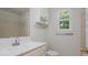 Bathroom with a window and neutral walls offers a clean aesthetic at 350 Birch Rill Dr, Alpharetta, GA 30022