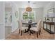 Bright dining room with a round table, four chairs, and view to the backyard at 350 Birch Rill Dr, Alpharetta, GA 30022
