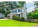 Inviting two-story home featuring stone accents, blue shutters, and a well-manicured front yard at 350 Birch Rill Dr, Alpharetta, GA 30022