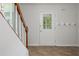Foyer with a staircase, a glass-paneled door, and coat hooks for added convenience at 350 Birch Rill Dr, Alpharetta, GA 30022