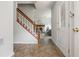 Inviting foyer with staircase, view to living room with fireplace, and a front door at 350 Birch Rill Dr, Alpharetta, GA 30022